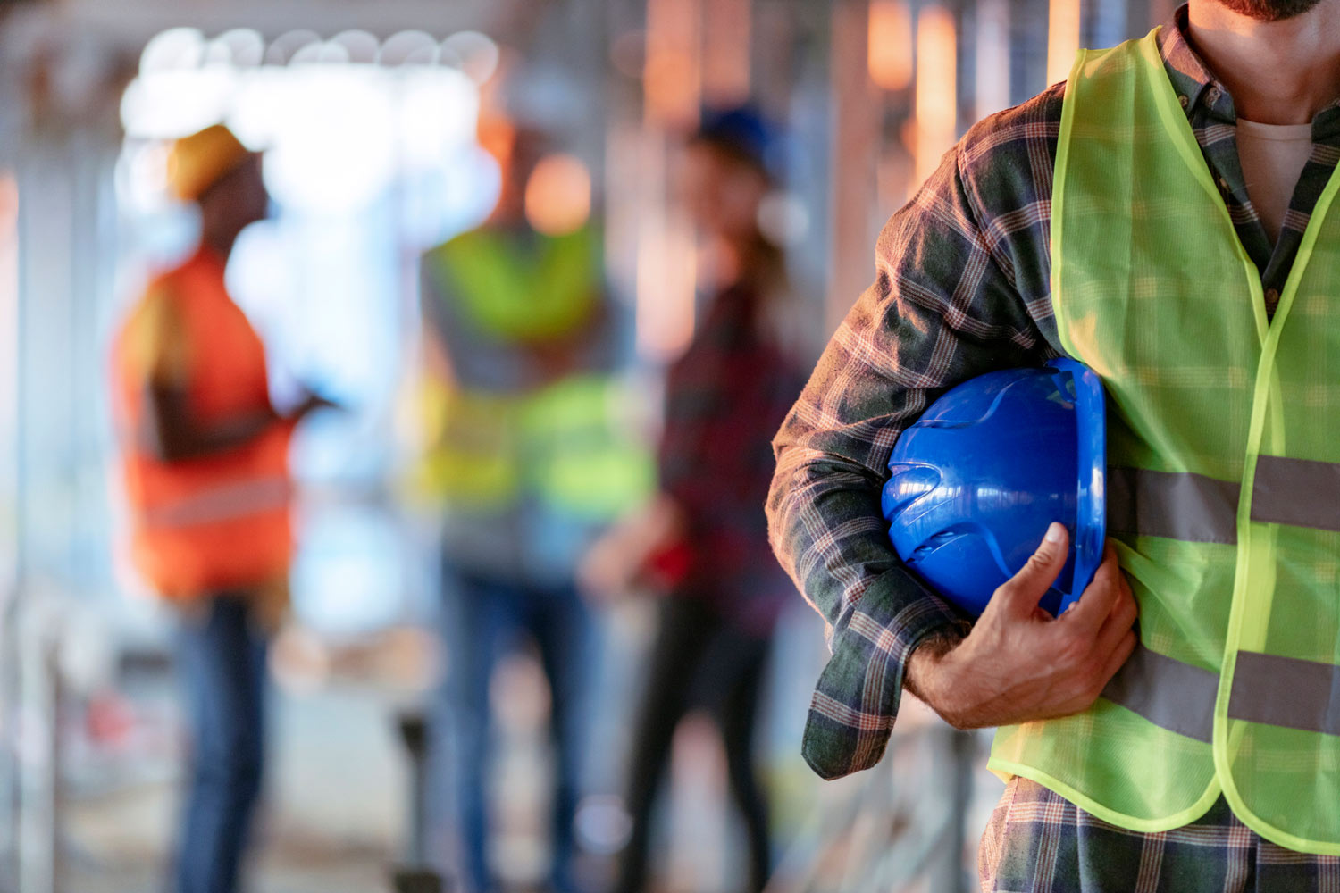 electricians working on site with helmets