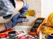 Industrial electrician completing work